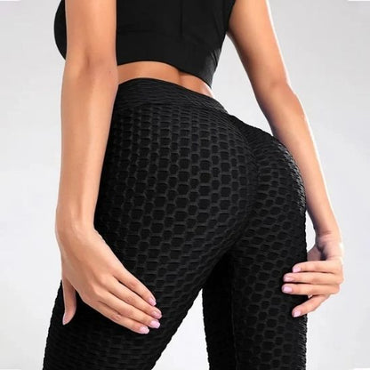 femme dos a nous montre la couleur des leggings noir 