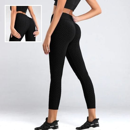 femme dos nous montre couleur noir des leggings 